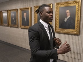 Joseph-Christopher Luamba arrives for his court challenge Monday, May 30, 2022, in Montreal. Luamba is suing the government over alleged police racial profiling.
