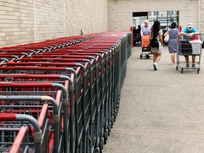 People walk outside a Costco on July 28, 2022, in Arlington, Virginia. The U.S. economy contracted for a second straight quarter between April and June, government data showed July 28, adding fuel to recession fears in a headache for President Joe Biden ahead of midterm elections.