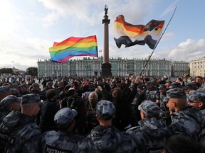 Law enforcement officers block participants of the LGBT community rally "X St.Petersburg Pride" in central Saint Petersburg, Russia August 3, 2019.