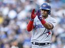 Santiago Espinal of the Toronto Blue Jays reacts after his single against the Seattle Mariners during the first inning at T-Mobile Park on July 8, 2022 in Seattle, Washington. 