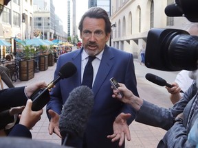 Pierre Karl Peladeau, president and CEO of Quebecor, speaks with reporters in Ottawa on May 31, 2022.