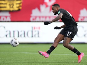 Canada's Cyle Larin, 17, scores against the USA during men's first half World Cup Qualifier at sold out Tim Hortons Field in Hamilton, Ontario on Sunday Jan. 30, 2022. Larin is joining fellow Canadian Tajon Buchanan at Belgium's Club Brugge.