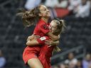 Canada's Julia Grosso, left, celebrates scoring her second goal with Jordyn Huitema  against Trinidad and Tobago at the Concacaf W Championship at the BBVA Stadium in Monterrey, Mexico, on July 5, 2022. 