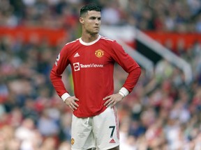 Manchester United's Cristiano Ronaldo stands on the pitch during the English Premier League soccer match between Manchester United and Norwich City at Old Trafford stadium in Manchester, England, on April 16, 2022.
