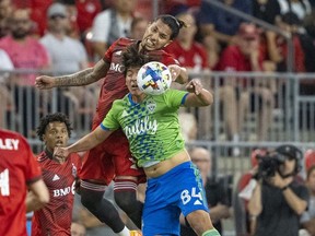 Jul 2, 2022; Toronto, Ontario, CAN; Toronto FC defender Carlos Salcedo (3) battles for the ball against Seattle Sounders midfielder Josh Atencio (84) at BMO Field.