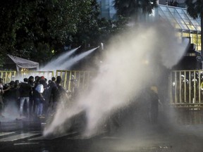 Police uses water canon to disperse protesting students in Colombo, Sri Lanka, Friday, July 8, 2022.