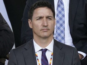 Prime Minister Justin Trudeau listens to Pope Francis deliver an apology for the Catholic Church’s role in residential schools in Canada in Maskwacis, Alta., July 25, 2022.