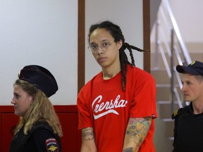U.S. basketball player Brittney Griner, who was detained in March at Moscow's Sheremetyevo airport and later charged with illegal possession of cannabis, is escorted before a court hearing in Khimki, outside Moscow, Russia July 7, 2022.