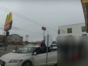 Police are seen in police body-cam footage during an arest outside a McDonald's in Midvale, Utah in February.