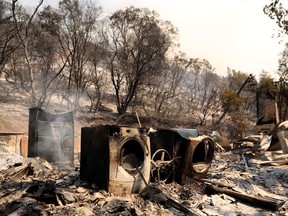 A view of a burned home after the Oak Fire moved through the area on July 23, 2022, near Mariposa, California.