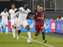 LA Galaxy defender Sega Coulibaly battles for the ball with Toronto FC midfielder Lorenzo Insigne.