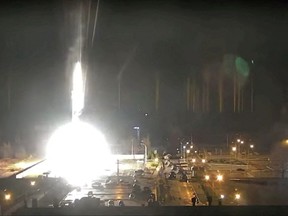 Surveillance camera footage shows a flare landing at the Zaporizhzhia nuclear power plant during shelling in Enerhodar, Zaporizhia Oblast, Ukraine March 4, 2022, in this screengrab from a video obtained from social media. Zaporizhzhya.