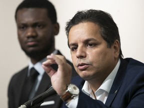 Ensemble Montréal public security spokesperson Abdelhaq Sari, right, speaks about the party's call for Montreal police to launch a “web patrol” unit to monitor social networks on Wednesday August 10, 2022. He's accompanied by Philippe Thermidor, city councillor for the Montreal North district of Ovide-Clermont.