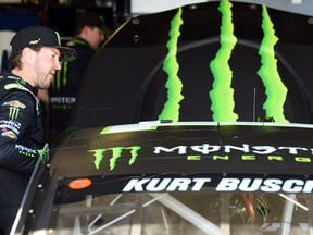 Kurt Busch, driver of the #1 Monster Energy Chevrolet, gets into his car before practice for the Monster Energy NASCAR Cup Series FireKeepers Casino 400 at Michigan International Speedway on June 07, 2019 in Brooklyn, Michigan.