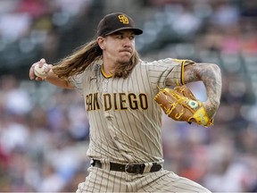 Mike Clevinger of the San Diego Padres delivers a pitch against the Detroit Tigers during the bottom of the first inning at Comerica Park on July 26, 2022 in Detroit, Michigan.