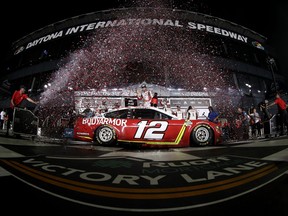 DAYTONA BEACH, FLORIDA - AUGUST 28: Ryan Blaney, driver of the #12 BodyArmor Ford, celebrates in the Ruoff Mortgage victory lane after winning the NASCAR Cup Series Coke Zero Sugar 400 at Daytona International Speedway on August 28, 2021 in Daytona Beach, Florida.