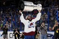 Nazem Kadri #91 of the Colorado Avalanche lifts the Stanley Cup after defeating the Tampa Bay Lightning 2-1 in Game Six of the 2022 NHL Stanley Cup Final at Amalie Arena on June 26, 2022 in Tampa, Florida. (Photo by Bruce Bennett/Getty Images)