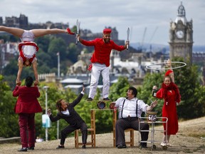 Circus company Lost in Translation show off some tricks at the top of Calton Hill on August 1, 2022 in Edinburgh, Scotland. The Guinness World Record-holding circus company will be performing their fun and acclaimed family show "Hotel Paradiso" at the Circus Hub throughout the Fringe.