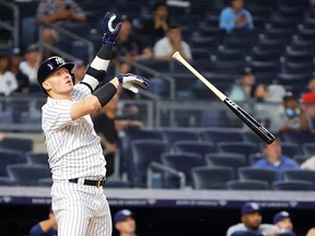 Josh Donaldson #28 of the New York Yankees celebrates after hitting a walk-off grand slam home run in the tenth inning against the Tampa Bay Rays at Yankee Stadium on August 17, 2022 in New York City.