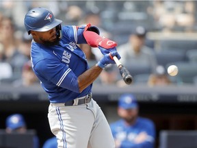 Teoscar Hernandez #37 of the Toronto Blue Jays connects on a base hit in the fourth inning against the New York Yankees at Yankee Stadium on August 21, 2022 in New York City.