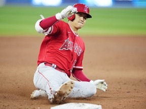 Shohei Ohtani of the Los Angeles Angels slides into third base with an RBI triple against the Toronto Blue Jays.
