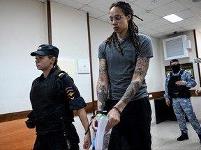Basketball player Brittney Griner, who was detained at Moscow's Sheremetyevo airport and later charged with illegal possession of cannabis, leaves the courtroom before the court's final decision in Khimki outside Moscow, on August 4, 2022.