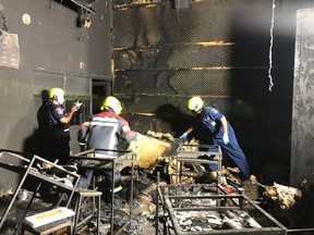 This handout photo taken and released on August 5, 2022 by the Sawang Rojanathammasathan Rescue Foundation shows rescue workers inside the Mountain B nightclub after a fire in Sattahip district in Thailand's Chonburi province.