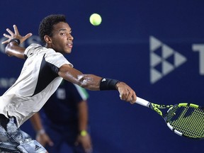 Canada's Felix Auger-Aliassime returns the ball to USA's Steve Johnson during their Mexico ATP Open 250 men's singles tennis match at the Cabo Sports Complex in Los Cabos, Mexico, on August 4, 2022.
