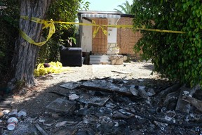 Charred debris and caution tape are seen August 8, 2022 at the site where actress Anne Heche crashed into a home in Mar Vista, California. (Photo by CHRIS DELMAS/AFP via Getty Images)