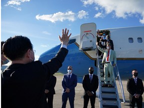 Taiwan Foreign Minister Joseph Wu waves at U.S. House of Representatives Speaker Nancy Pelosi and other members of the delegation as they board a plane before leaving Taipei Songshan Airport, in Taipei, Taiwan August 3, 2022.
