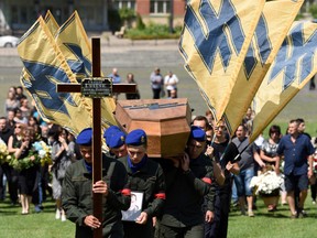 Ukrainian soldiers carry the coffin of Vasyl Sushchuk, an Azov Regiment serviceman killed during the Russian invasion of Ukraine, during his funeral in the western Ukrainian city of Lviv, on July 29, 2022.