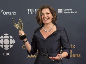 Lisa LaFlamme holds her award for best news anchor at the Canadian Screen Awards in Toronto on March 1, 2015.