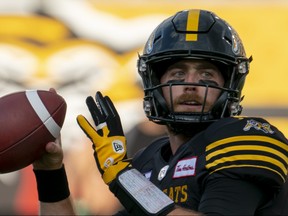 Hamilton Tiger Cats quarterback Dane Evans (9) throwing during warm up prior to CFL football game action against the Montreal Alouettes in Hamilton, Ont. on Thursday, July 28, 2022.