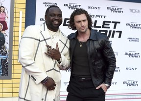 Brian Tyree Henry, left, and Aaron Taylor-Johnson arrive at the premiere of “Bullet Train” on Monday, Aug. 1, 2022, at the Regency Village Theatre in Los Angeles.