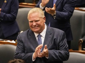 Ontario Premier Doug Ford applauds as Lt.-Gov. Elizabeth Dowdeswell delivers her Speech from the Throne at Queen's Park in Toronto, on Tuesday,  Aug. 9, 2022.