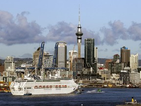 The Pacific Explorer sails into the Waitemata Harbour, in Auckland, New Zealand, Friday, Aug. 12, 2022.