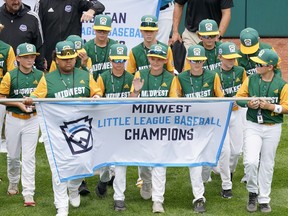 Midwest Region Champion Little League team from Davenport, Iowa, participates in the opening ceremony of the 2022 Little League World Series baseball tournament in South Williamsport, Pa., Wednesday, Aug 17, 2022.