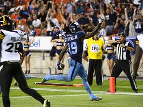 Toronto Argonauts wide receiver Kurleigh Gittens Jr. (19) scores a touchdown during first half CFL football action against the Hamilton Tiger-Cats in Toronto on Friday, August 26, 2022.