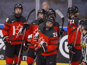 In this file photo taken on Aug. 27, 2022, players of Canada celebrate after Emily Clark has scored to 3-0 during the IIHF World Championship Woman's ice hockey match between Canada and Switzerland in Herning, Denmark.
