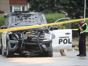 Toronto Police investigate after a Police Dog Service supervisor's SUV - with two dogs in the rear of it was stolen by a suspect at a retail break-and-enter at Yonge St. and Lawrence Ave. at 4:20 a.m. The suspect fled in the vehicle crashing it 12.5 kms west at Keefe St. and Lawrence Ave. West. on Monday August 8, 2022. Jack Boland/Toronto Sun