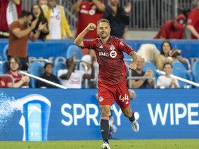 Toronto FC defender Domenico Criscito celebrates scoring against the New England Revolution during the second half at BMO Field on Wednesday night.