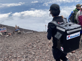 "I hiked up Mount Fuji yesterday. There was someone who ordered Domino's Pizza," tweeted the man with the thermal bag on his back.