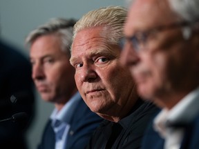 Ontario Premier Doug Ford, centre, attends a press conference with Nova Scotia Premier Tim Houston, left, and New Brunswick Premier Blaine Higgs following a meeting with the Maritime premiers in Moncton, N.B. on Monday, August 22, 2022.