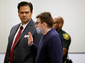 Marjory Stoneman Douglas High School shooter Nikolas Cruz is sworn in and waves his right to be present at the school while the jury walks through the crime scene during the penalty phase of his trial at the Broward County Courthouse in Fort Lauderdale, U.S., August 4, 2022.