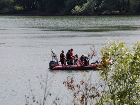 Rescue divers from the firefighter department patrol on Seine river in search for lost Beluga whale, in Les Andelys, France, August 5, 2022.