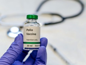 In this photo illustration, the poliomyelitis virus vaccine with stethoscope and syringe are pictured.