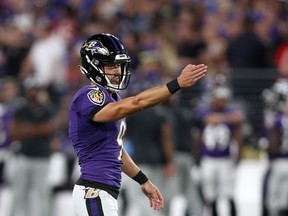 Justin Tucker of the Baltimore Ravens lines up an extra point against the Tennessee Titans in the first half of a preseason game on August 11, 2022 in Baltimore.