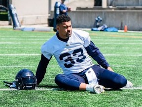 Running back Andrew Harris, here limbering up during an Argonauts practice, is done for the season after opting for surgery on a torn pectoral muscle early next week. It’ll be up to the 35-year-old future Hall of Famer if he wants to continue his career next year.