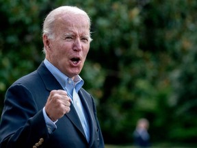 U.S. President Joe Biden answers a shouted question from a reporter while walking to Marine One on the South Lawn of the White House in Washington, D.C., Sunday, Aug. 7, 2022.