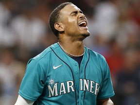 Julio Rodriguez of the Seattle Mariners reacts after striking out against the Cleveland Guardians at T-Mobile Park on August 26, 2022 in Seattle.
